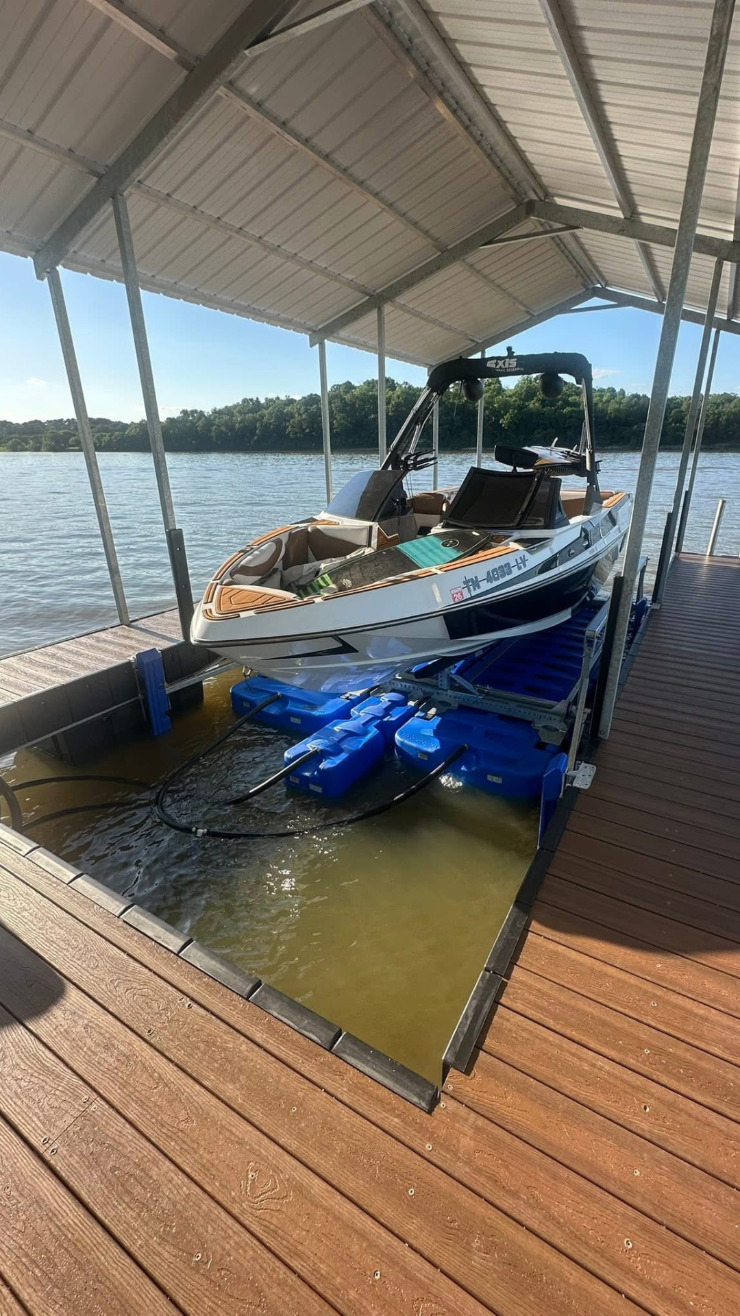 Boat lift installation on custom dock by Cumberland Marine Works Tennessee